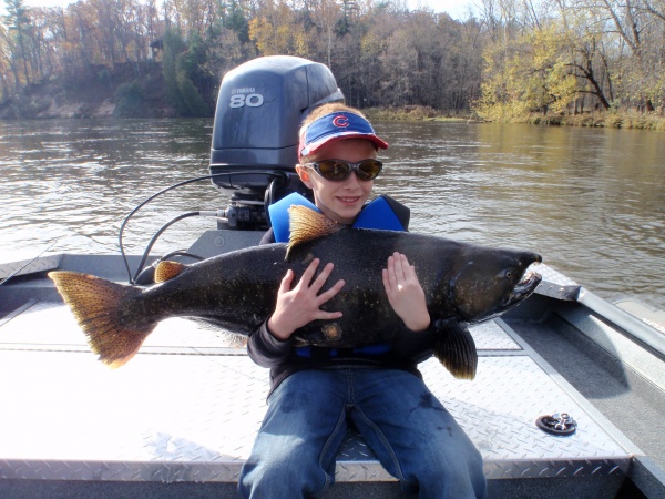 Jordan with a 30 lb king Muskegon river king salmon