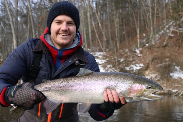 David with a beautiful chrome steelhead caught in January on the Muskegon river